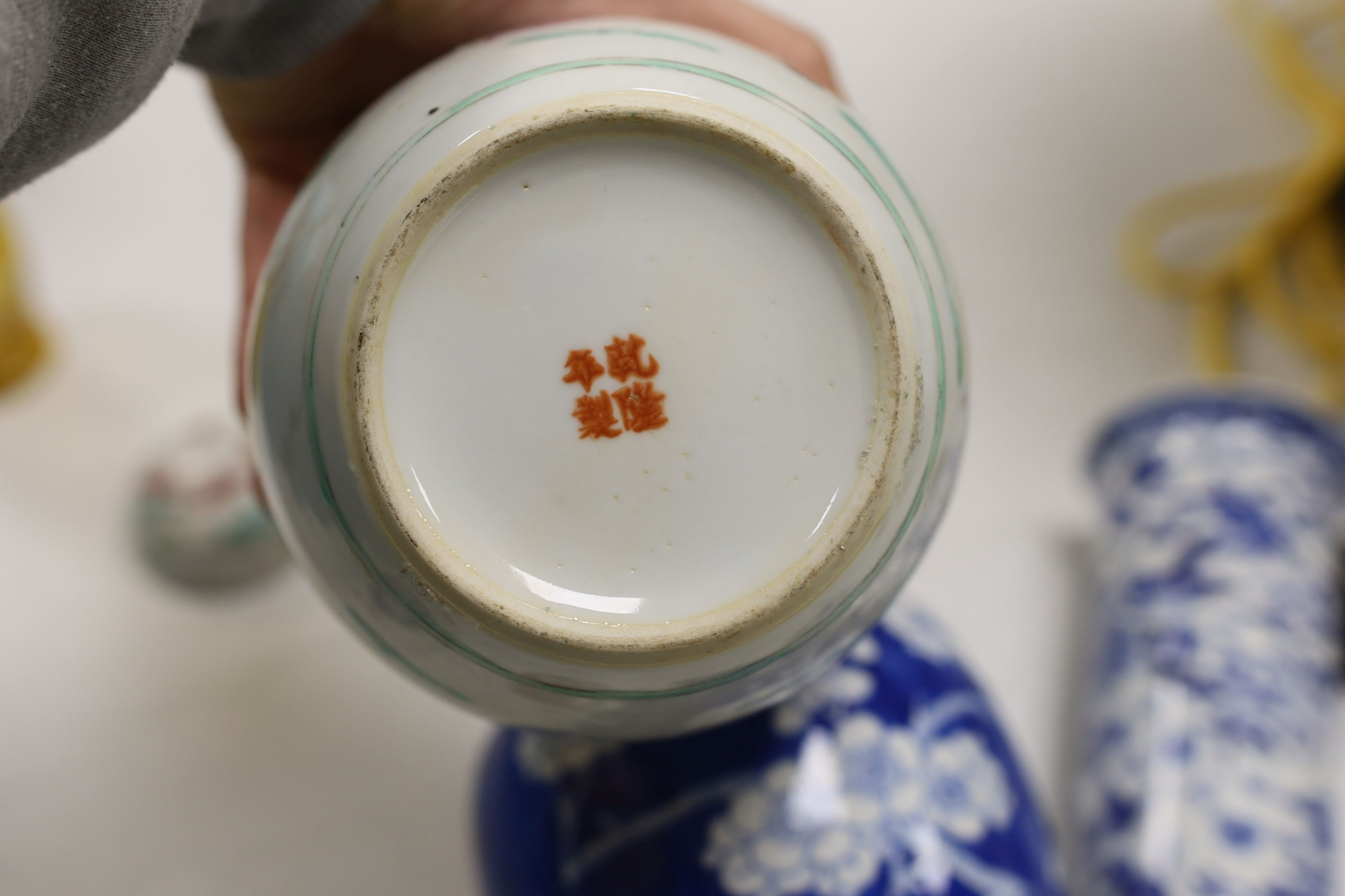 A Chinese famille rose ginger jar, a 19th century Chinese blue and white porcelain jar and cover, a blue and white cylinder vase, a small Chinese dish and orange glass vase (5)